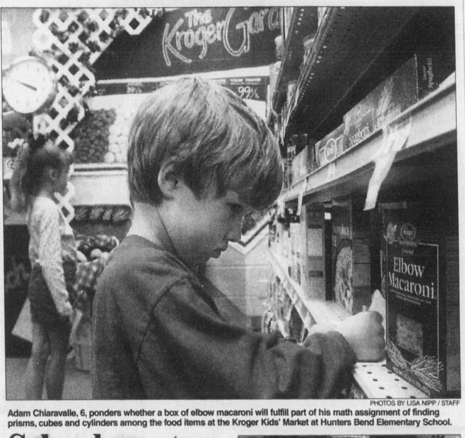 December 11, 1999: "Adam Chiaravalle, 6, ponders whether a box of elbow macaroni will fulfill part of his math assignment